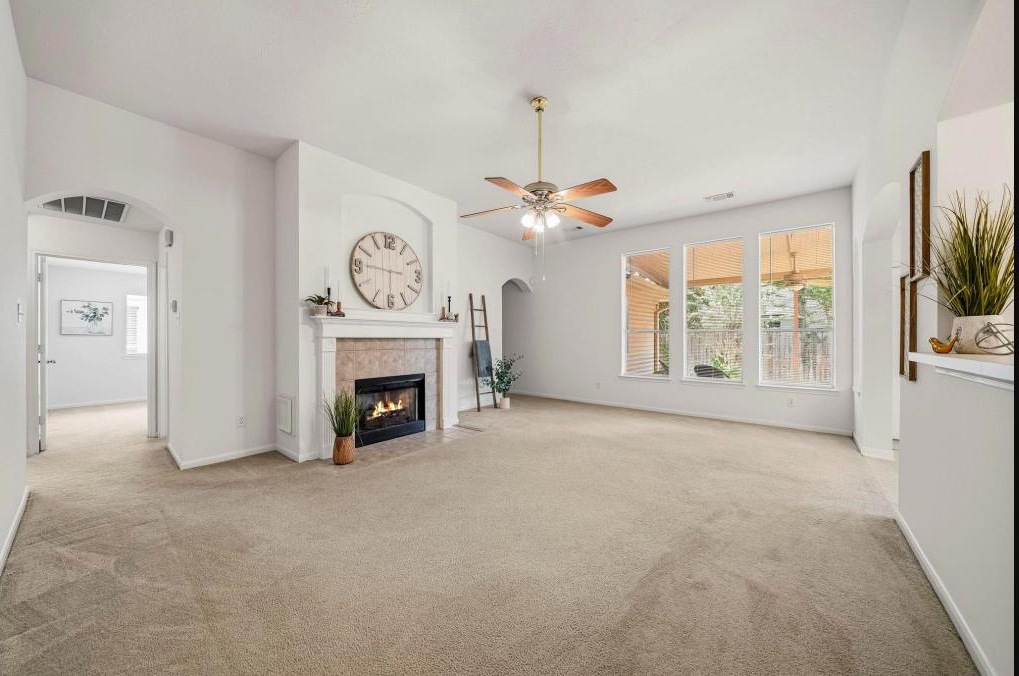 Bright, freshly painted living room in a Sugar Land home staged and ready to sell